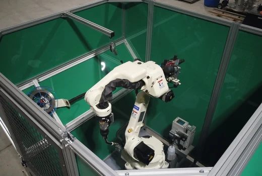 FD-B6 robot set up for welding inside cell.