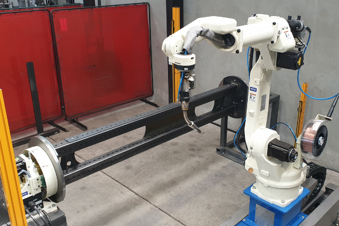 OTC FD-B6L robot positioned for structural dairy welding